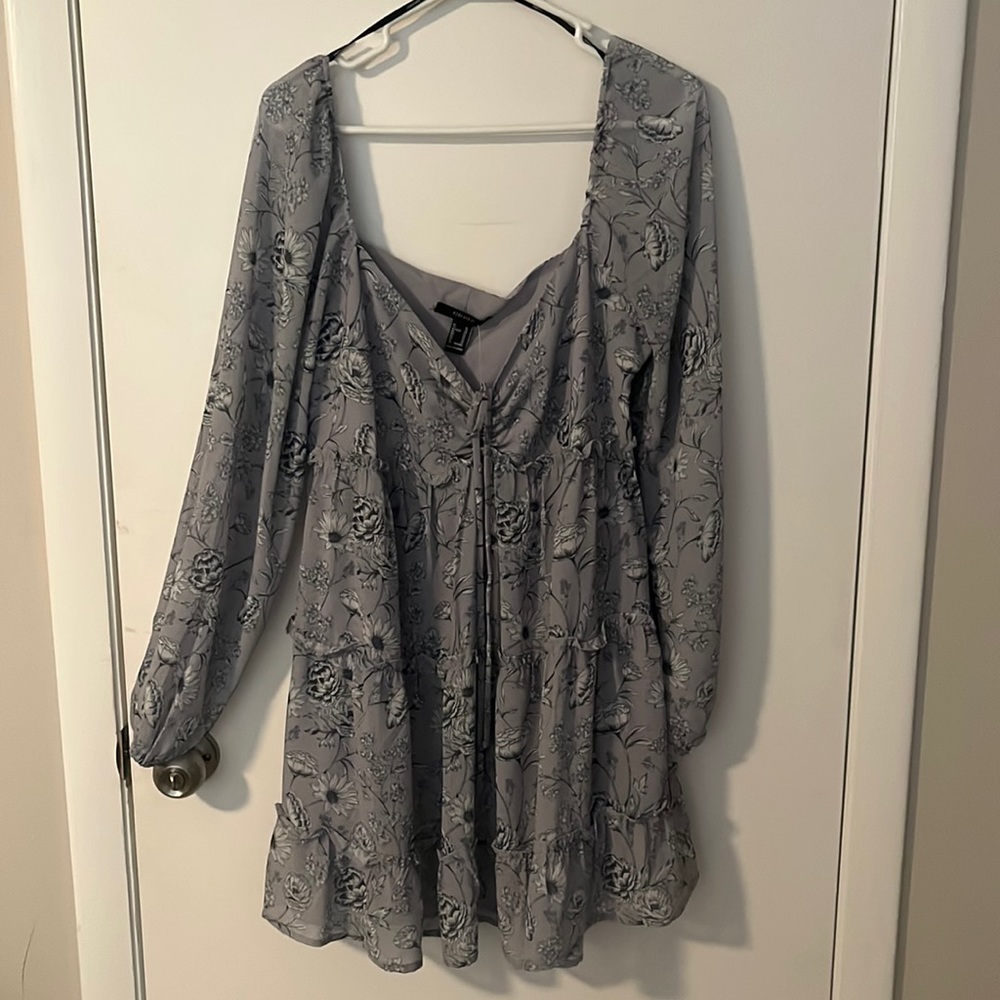Grayish blue dress with flower patterns. Zipper on the side and tie in front.